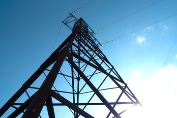 Electricity pole with a blue sky on background. Electricity pylon.