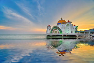 Kuala Lumpur, Malaysia - June 24, 2019: Beautiful sunset over the Malacca Straits Mosque or Masjid Selat. Selective focus