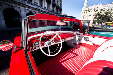 Interior of a red vintage car and view through the windshield, Havana, Cuba