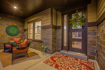Aeating area carpets and wall decoration on the porch with stone brick wall