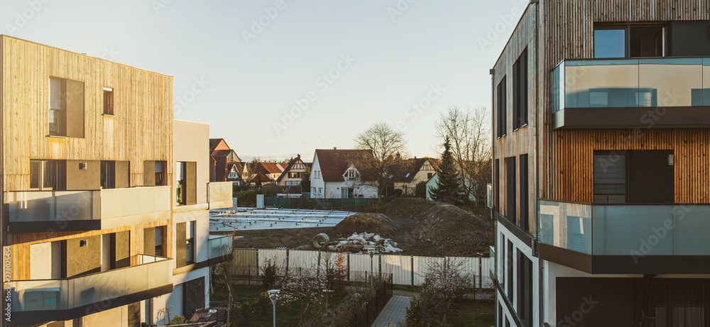 Wall mural wide image view from above of modern apartment buildings and construction site in the center of the 