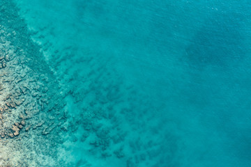 Aerial view of the sea and stones in the summer