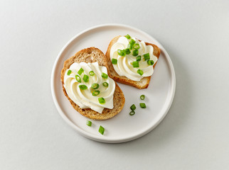plate of toasted bread with cream cheese
