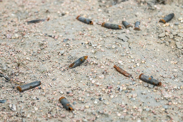 lots of old rusty gun sleeve on the ground
