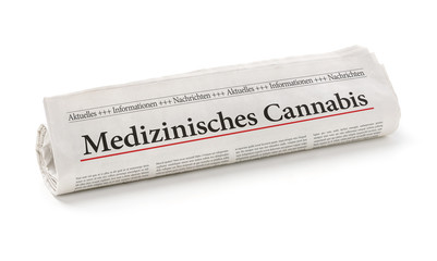 Zeitungsrolle mit der Überschrift Medizinisches Cannabis