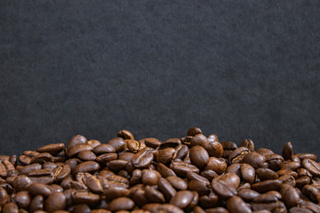 mockup of coffee beans on isolated dark textured background
