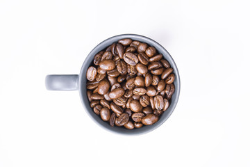 coffee beans in dark coffee cup on isolated white background