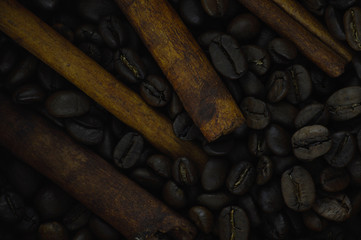 Aroma Cinnamon Sticks and Natural Rustic Coffee Beans Background