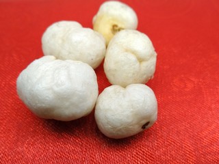 A picture of dry fruit on red background