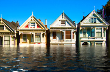 Digital manipulation of flooded row of wooden buildings. Climate change concept - Image