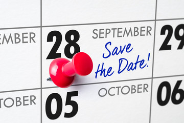 Wall calendar with a red pin - September 28