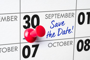 Wall calendar with a red pin - September 30