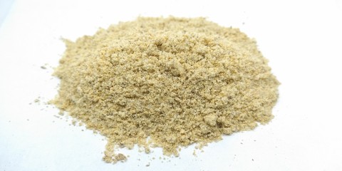 A picture of fenugreek powder on white surface