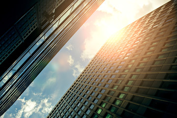 Looking up skyscrapers at sunset, color toning applied