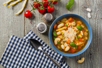 Minestrone soup with pasta and cheese.