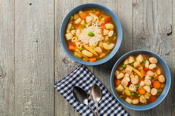 Minestrone soup with pasta and cheese or crostini.