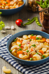 Minestrone soup with pasta and cheese.