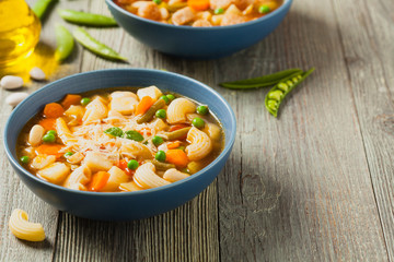 Minestrone soup with pasta and cheese.
