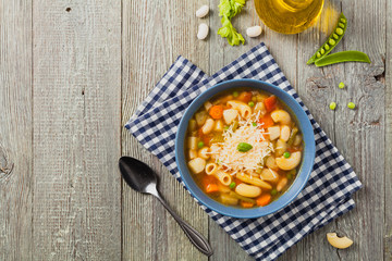 Minestrone soup with pasta and cheese.