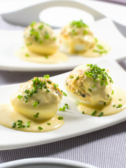 aperitivos y tapas de España, huevos rellenos con mahonesa. appetizers and tapas from Spain, stuffed eggs with mayonnaise.