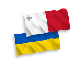 National vector fabric wave flags of Malta and Ukraine isolated on white background. 1 to 2 proportion.