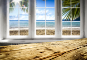 Wooden table background in the window sunshine in the summer