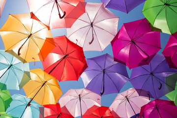 Fototapeta na wymiar Colorful umbrellas background. Street decoration in France.