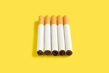 Cigarette on the yellow background