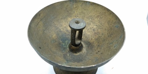 A picture of rusted lamp on white background