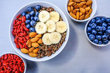 Healthy Vegetarian Breakfast Bowl With Quinoa Fresh Fruit and Nuts