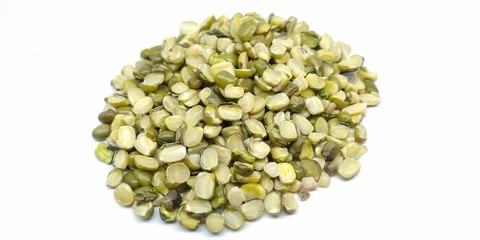 A picture of split green moong daal on a white background