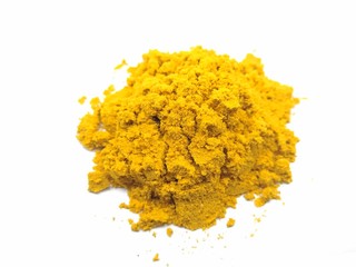 A picture of turmeric powder on a white background