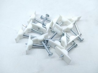 A picture of white wall pins isolated on white background