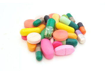 Medication and healthcare concept. Many colorful tablets, pills, drugs isolated on white background