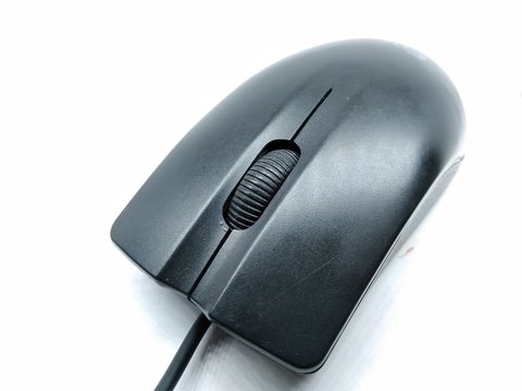 A picture of black computer mouse isolated on white background