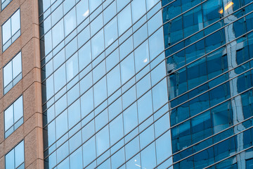 Fototapeta na wymiar Blue windows of office building close up. Real estate lease concept.