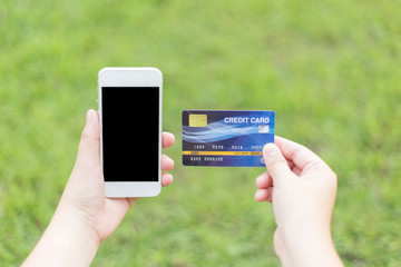 Young women are buying products online via the internet and making payments via credit cards online.