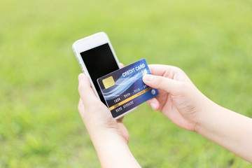 Young women are buying products online via the internet and making payments via credit cards online.