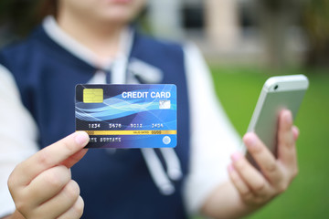 Young women are buying products online via the internet and making payments via credit cards online.