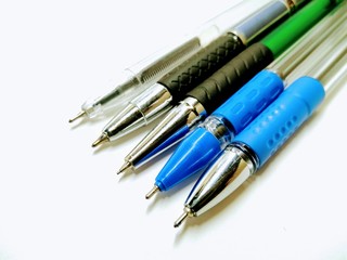 A picture of ink pens on a white background