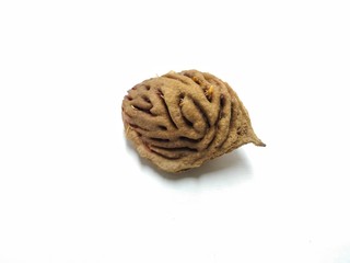 A picture of peach seed on a white background