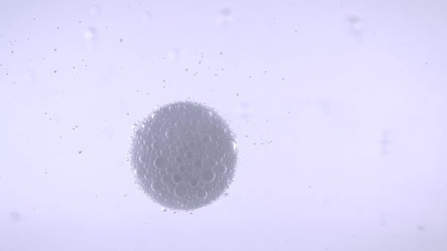 Closeup shoot of medical pill dissolving in a water with fizzy bubbles with background isolated on white