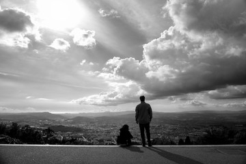 silhouette of man on top of mountain