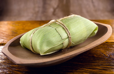 Pamonha and Curau stroller sale - typical green corn and cheese food - common Brazilian food at rural parties in June and July. Homemade dessert.