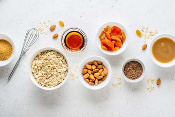 Ingredients for cooking homemade granola (muesli). Healthy breakfast.