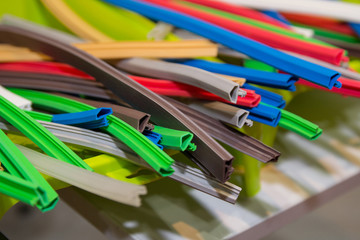 Variety of colored extruded rubber profile (seal). Industry