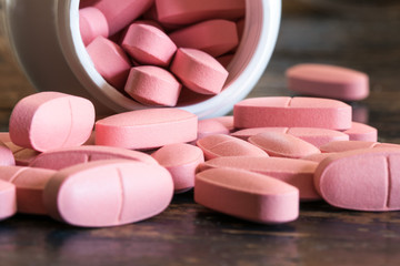 Calcium Tablets Spilled from a Spice Jar