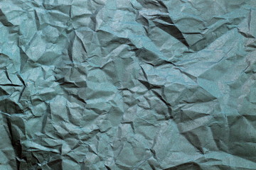 Texture of crumbled paper. background of mint old leaf closeup