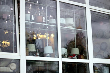 Shop lighting showcase with chandeliers. Street view of the window