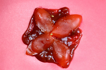 Tomato fell from above and turned into crumbs. Crushed, crushed, damaged vegetable.